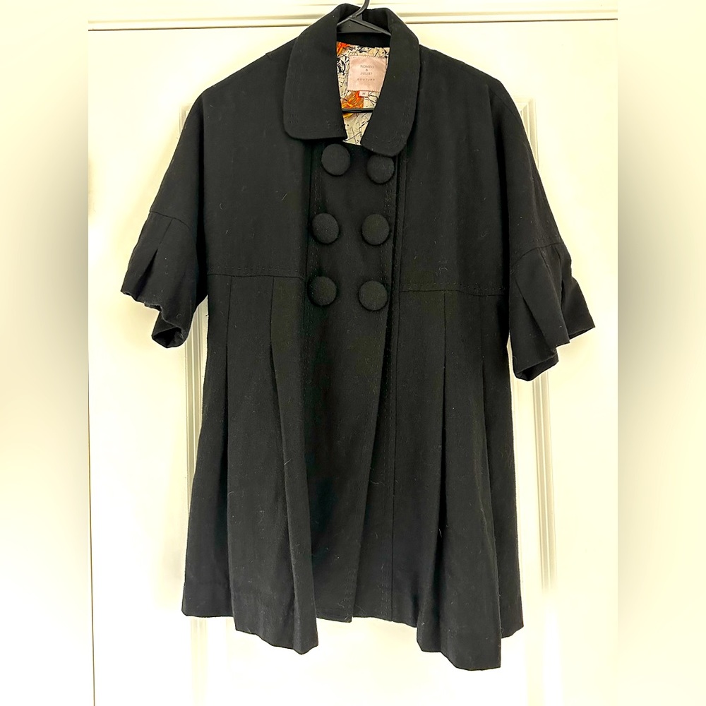 Black pleated overcoat